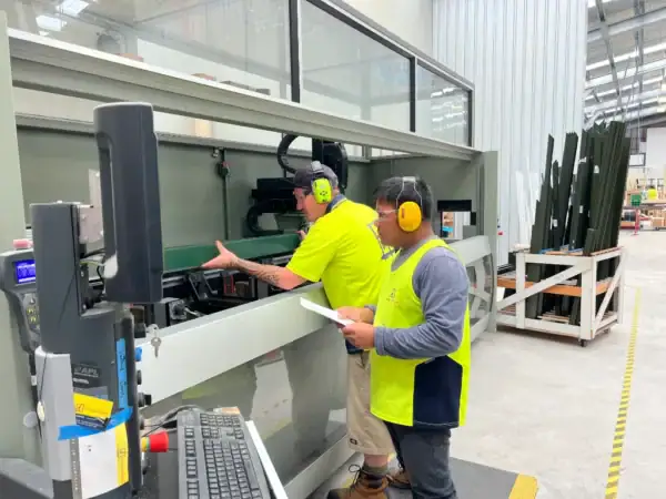 Glaziers working on windows at Design Windows West Coast