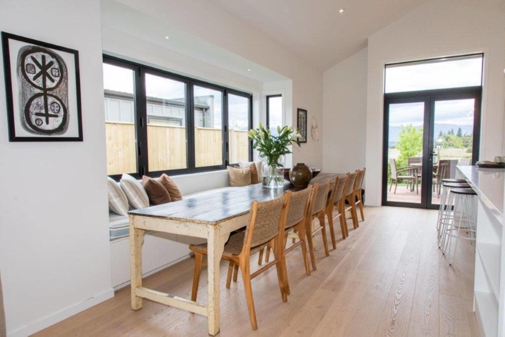 Dining room with closed aluminium windows and french doors