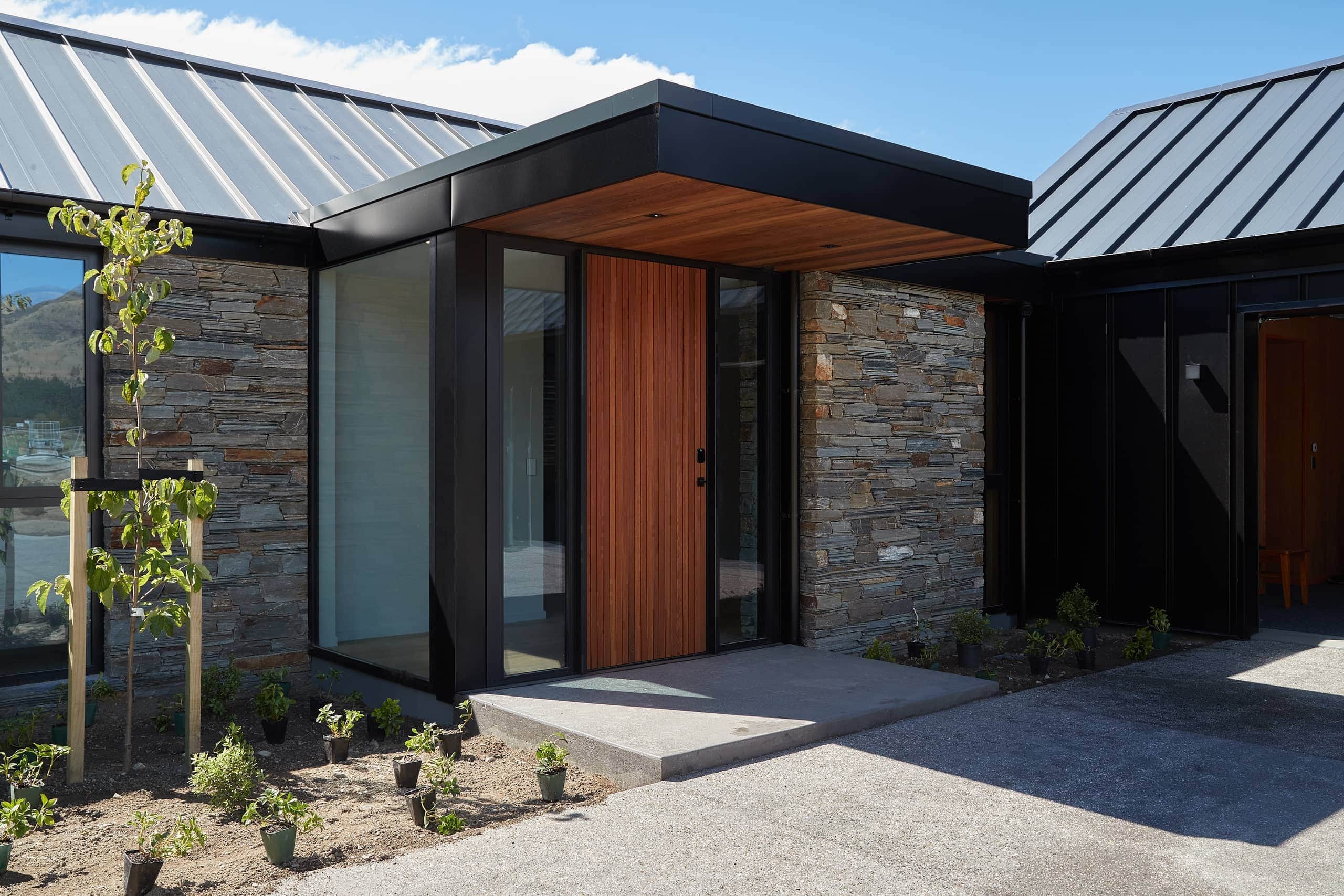 Wooden entrance door with side glass panels