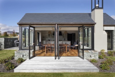 Showing open Aluminium french doors from dining room onto deck